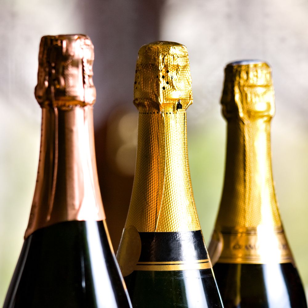 Study: sparkling wine capsules in gold and copper foil, seen close up